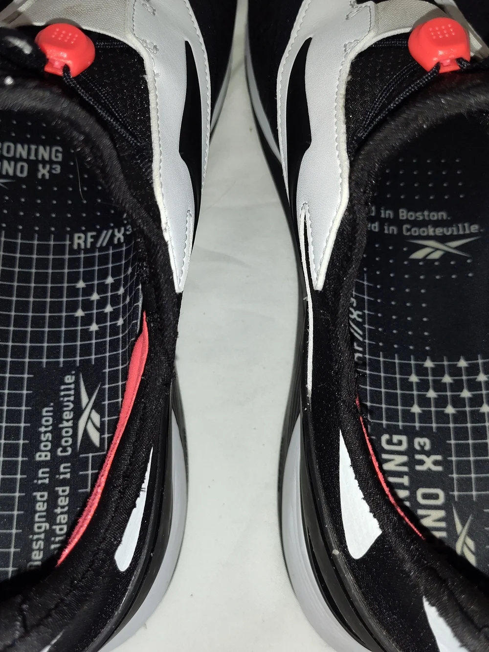 Reebok Men’s Black and White Athletic Slip-On Sneakers
